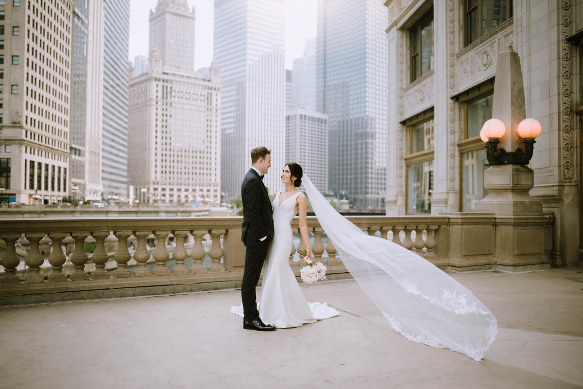 Couple beneath the Wrigley Building in Chicago